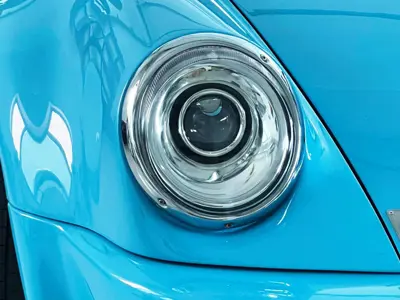 Juego de faros LED con reflector cromado y lente transparente para el lado izquierdo del conductor. Porsche 911 / 964 - 91163111302, 91163102400, 91163111300